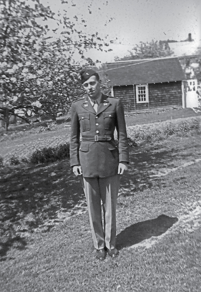 soldier in uniform standing stiffly outdoors