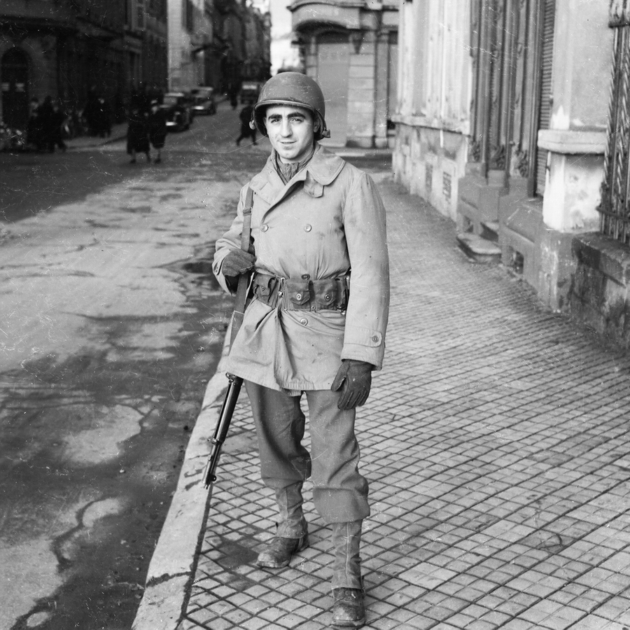 Soldier standing in a city street