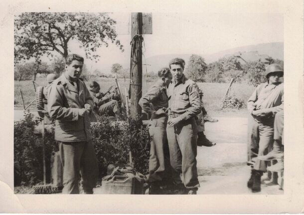 group of soldiers standing near a pole