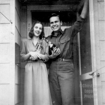 soldier and a woman in a doorway with wine bottles