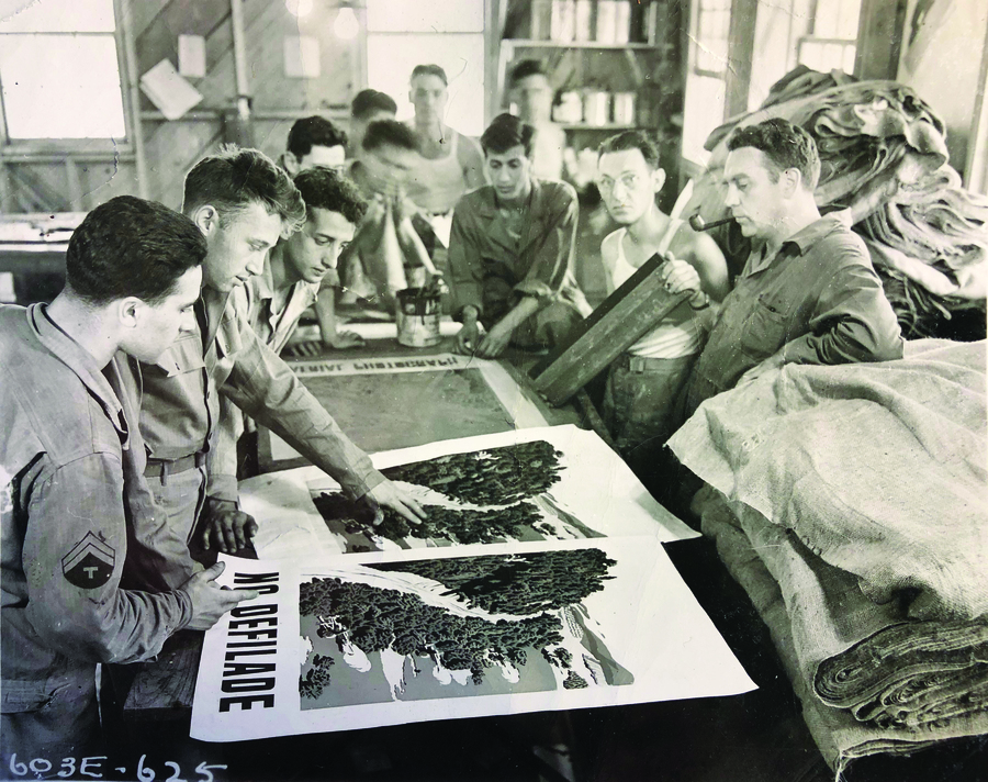 a group of uniforned men looking at silkscreened posters
