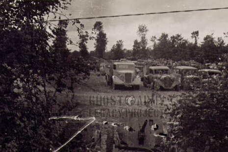Trucks in a field in world war 2 camouflaged