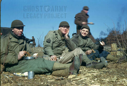 Soldiers in WW2 during basic training relaxing on the ground