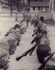 rifles and sandbags in training center