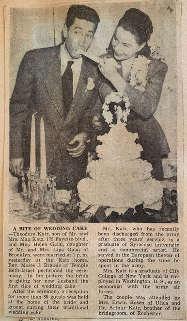 newspaper clipping announcing wedding, with photo of the bride and groom with their wedding cake