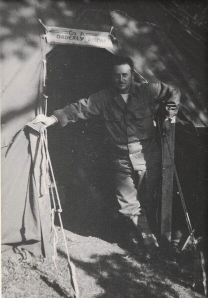 soldier standing at the entrance of a tent