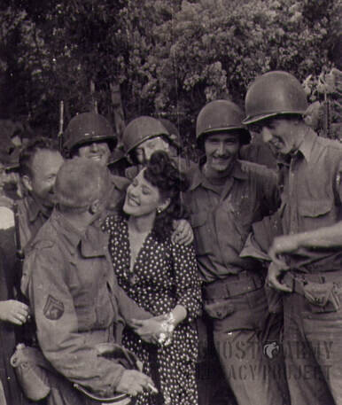 Soldiers flirting with visiting woman 1943