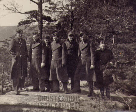 US Soldiers in overcoats on top of a hill in USA