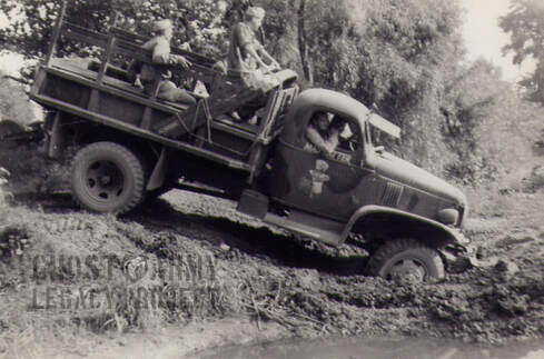 army truck in muddy ditch