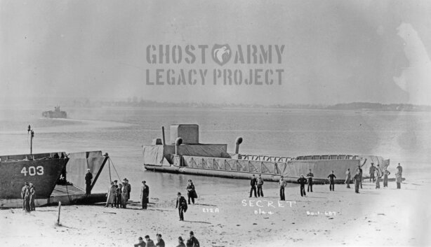 decoy landing craft by the shore with people walking toward it